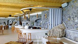 Sliding shutter, stacked away against the wall, leaving the bar area open
