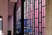 Installation of a sliding security shutter with working drawings in the foreground