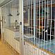 Classic chainlink sliding folding grille in front of food servery