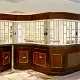 high-end reception desk protected by counter-height curved FlexiGlide Vision Guard sliding security shutter