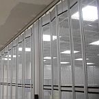 Detail of a Vision Air sliding folding security shutter at ceiling level.
