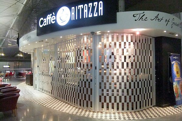 Aluminium anodised sliding folding shutter at a cafetaria