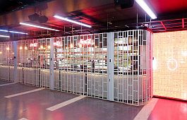 Sliding folding shutter in front of a bar at the O2 Arena London